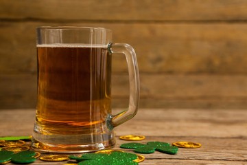 Mug of beer, chocolate gold coins and shamrock 