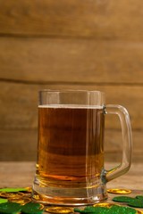 Mug of beer, chocolate gold coins and shamrock 