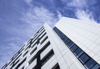 Corner office building view from below against sky