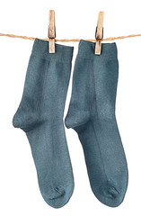 Dark blue socks on rope with clothespins