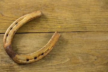 Horseshoe on wooden surface