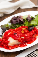 cod fish with red grilled pepper and salad