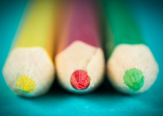 tips of three colored pencil 