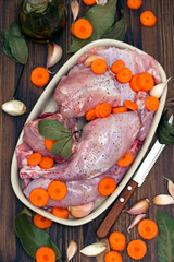 raw rabbit with carrot on dish