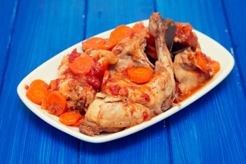 rabbit stew with carrot on white dish