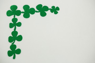 St Patricks Day shamrocks forming corner frame