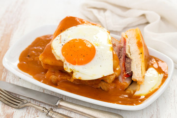 portuguese sandwich francesinha with fried egg