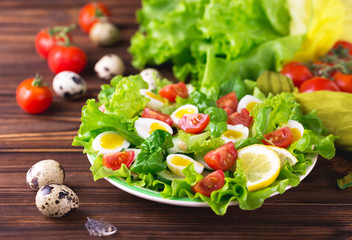 Letucce, cucumber, spinach, basil and quail eggs salad