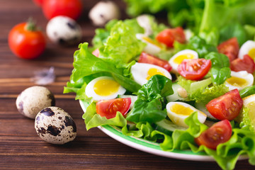 Letucce, cucumber, spinach, basil and quail eggs salad