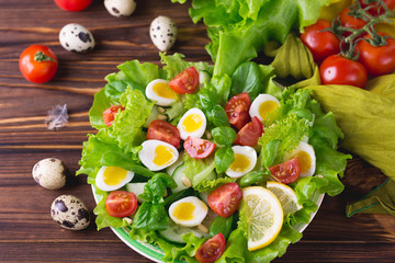 Letucce, cucumber, spinach, basil and quail eggs salad