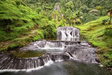 Fototapeten Long exposure view of the waterfall near the Santa Rosa Thermal Spa in Santa Rosa de Cabal in Colombia. © Danaan