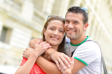 Couple hugging whilst in the city