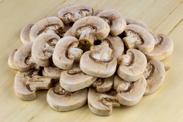 Small Mushrooms Sliced on a Wooden Table