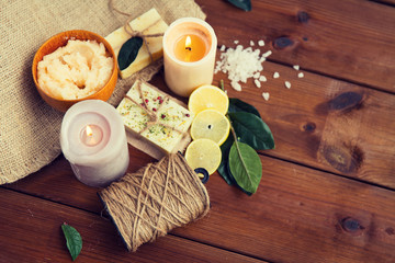 close up of natural soap and candles on wood