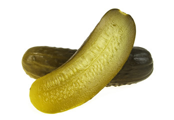 One pickled cucumber cut in half on white background