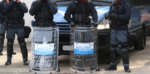 police with shields and riot gear during the event in the city