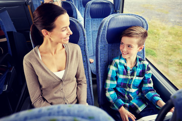 happy family riding in travel bus