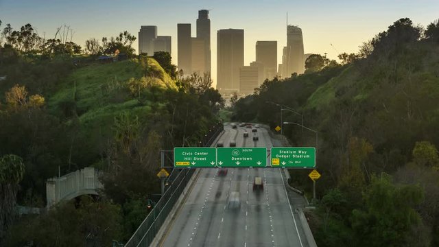 Timelapse of Los Angeles city freeway traffic at sunset 
