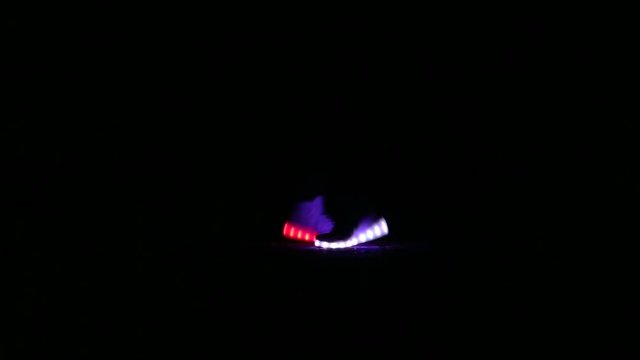 closeup of feet to dance in shoes that glow in the night