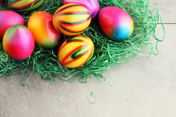 Row of Easter eggs on stone table