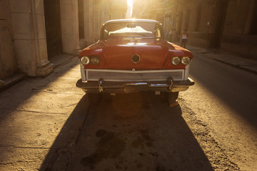 Old car on street of Havana at sunset, Cuba