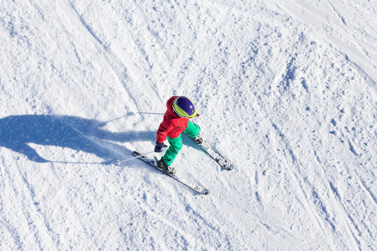 Top view portrait of boy riding fast on downhill