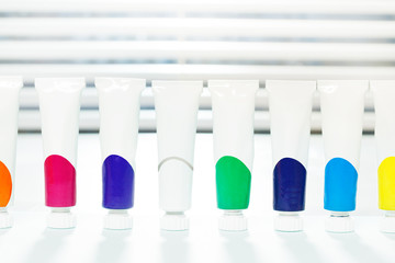 Small tubes of acrylic paint with copy-space