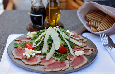 Carpaccio , beef steak salad. Summer launch, healthy eating concept