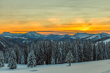 Mountains with sunrise light over fresh snow