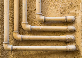 geometric pattern of 90 degree water pipes and fittings