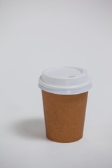Disposable coffee cup on white background