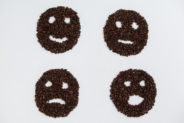 Coffee beans forming various faces