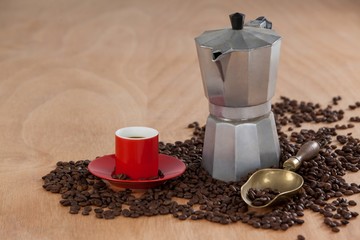 Coffee beans, coffee, coffeemaker and scoop