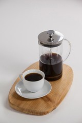 Cafetiere and a cup of black coffee