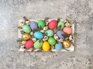 Fototapeta na wymiar Easter eggs decoration stone background