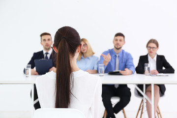 Job interview concept. Human resources commission interviewing woman