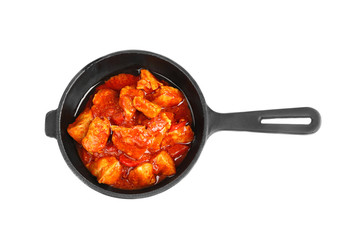 Frying pan with delicious chicken tikka masala isolated on white