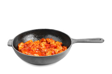 Frying pan with delicious chicken tikka masala isolated on white