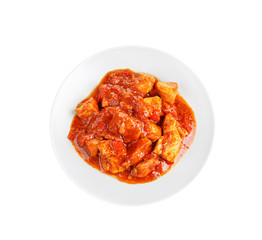 Plate with delicious chicken tikka masala isolated on white