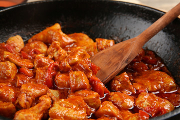 Frying pan with tasty chicken tikka masala, closeup