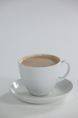 White cup of coffee with froth with creamy froth
