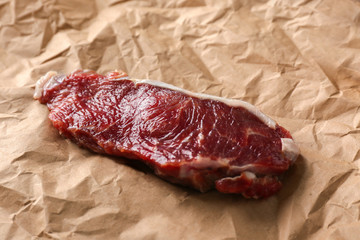 Cooking concept. Raw steak on parchment