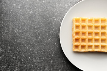 Delicious waffle on white plate