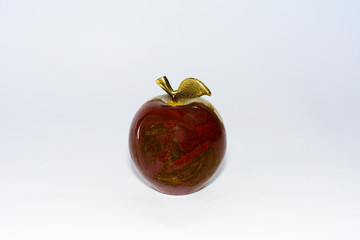 Apple made of onyx stone on a white background
