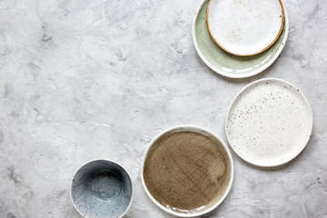 ceramic tableware top view on stone background mock up