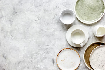 ceramic tableware top view on stone background mock up