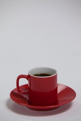 Black coffee served in red cup
