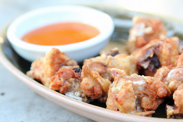 Thai food, deep fried chicken with chili sauce.