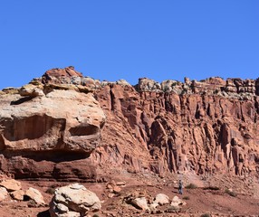 Fototapeta premium Man hiking near rocks in Capitol Reef Park, Utah.