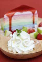 Whipped cream on wooden plate.